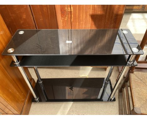 A BLACK GLASS THREE TIER CONSOLE TABLE 