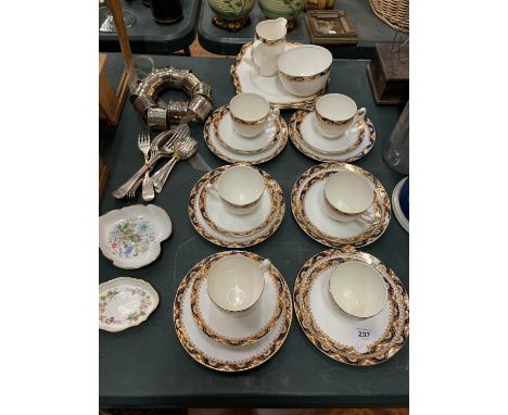 A TWENTY-TWO PIECE CHINA TEA SERVICE, TWO BON BON PLATES AND SILVER PLATED CUTLERY WITH SEVERAL NAPKIN HOLDERS 