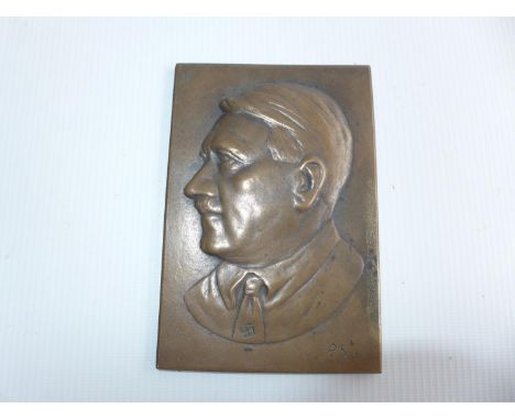 A BRONZE PLAQUE DEPICTING ADOLPH HITLER, MARKED WITH A SWASTIKA AND P.S. 13.5cm x 9cm 