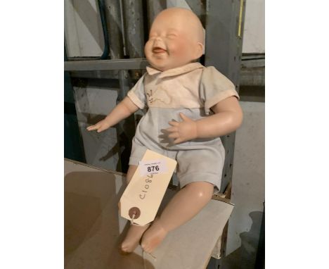 A VINTAGE DOLL 