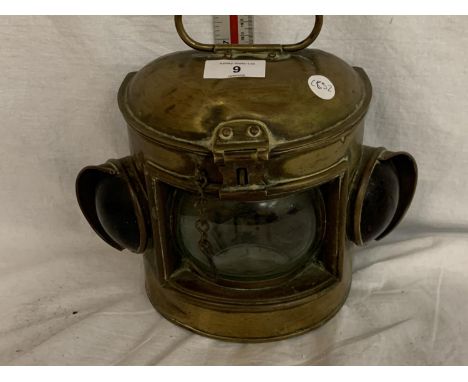 A VINTAGE BRASS PORT LAMP 