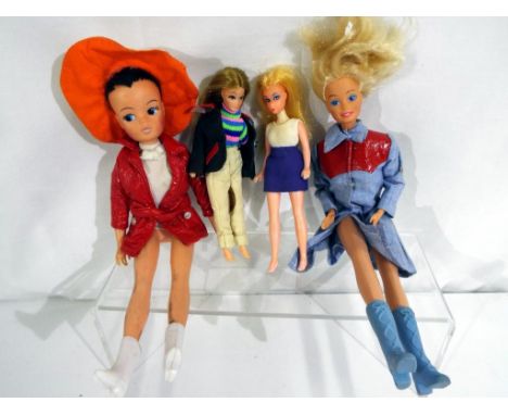 A collection of vintage fashion dolls to include Sindy marked to the rear of her head 2 GEN 1077,330557, a Barbie doll and a 