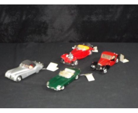 Diecast - Franklin Mint - a collection of four unboxed 1:24 scale Franklin Mint models cars, including 1952 Jaguar XK120, 196