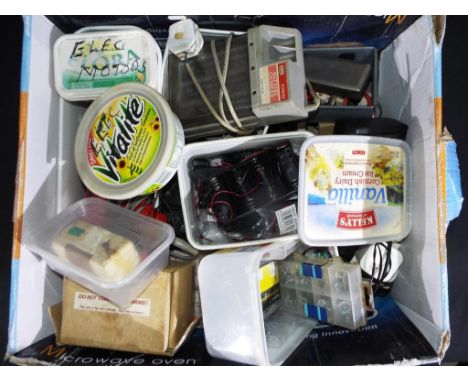 A good mixed lot of RC boat accessories to include Megger tester, wiring, craft knives, battery charges, electric motors and 