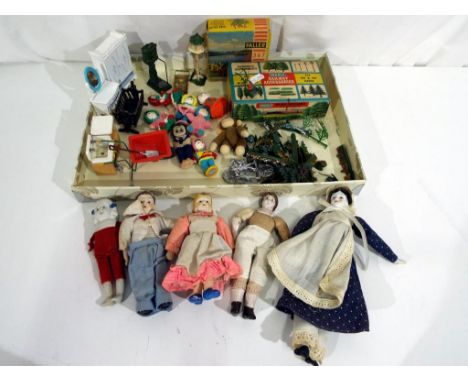 A good mixed lot of vintage doll's house accessories and toys to include a Tri-ang Spot-On wheelbarrow, a miniature lawnmower