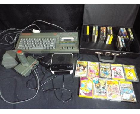 Vintage Gaming - A Spectrum 128K +2 personal computer with joystick and games, predominantly in original cases to include Top