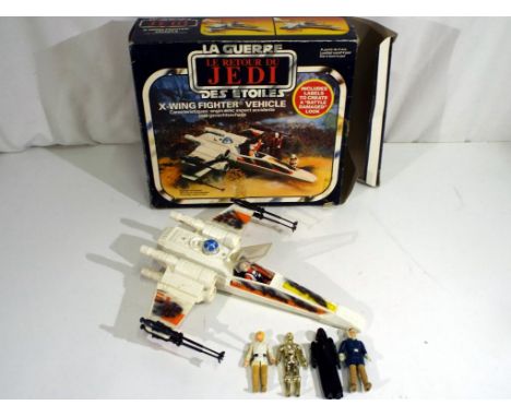 Star Wars - a vintage boxed Kenner Star Wars Return of the Jedi Battle Damage X-Wing Fighter, and six uncarded vintage Star W