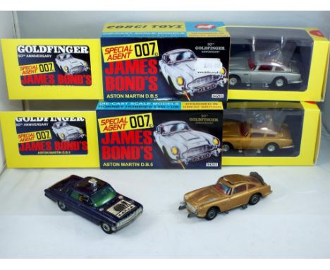 Corgi - a lot containing four diecast Corgi vehicles, including two James Bond Aston Martin DB5 550th Goldfinger Anniversary,