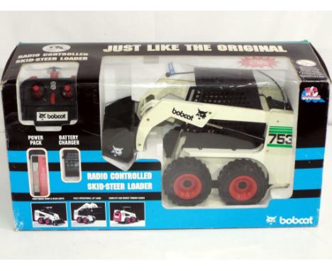 Radio Controlled - a large scale boxed radio controlled Skid Steer Loader by Bobcat, item appears m in e box Est £30 - £50