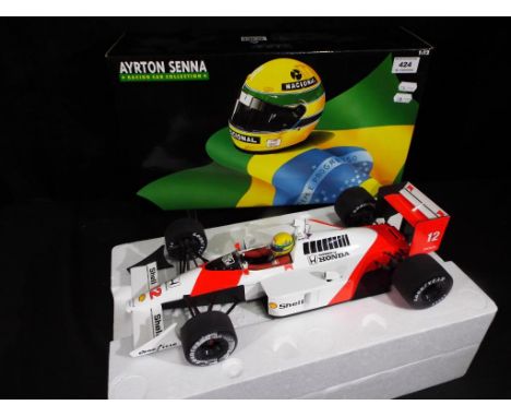 Ayrton Senna - a 1:12 scale diecast racing car 540 881212 Mclaren MP4/4 1988, boxed