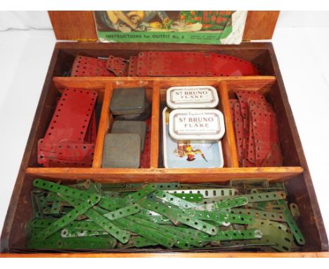 A vintage wooden box, containing a large quantity of early Meccano one related ephemera booklet outfit #6, Est £35 - £50