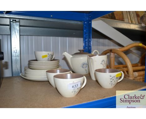 A collection of Poole pottery twin tone teaware