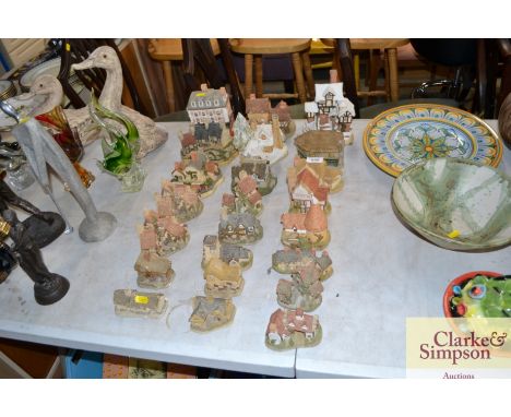 A quantity of various model cottages and churches, mostly David Winter