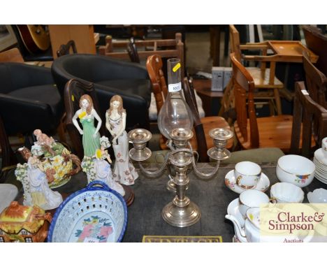 A silver plated paraffin lamp and glass chimney together with a silver plated candelabra