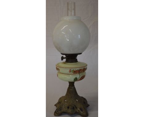 Oil lamp with a floral reservoir and white shade