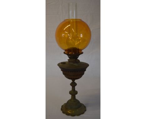 Oil lamp with an amber glass shade