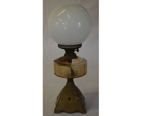 Oil lamp with ornate base depicting sailing boats