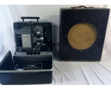 Bell & Howell film projector with cabinet speaker & film spool