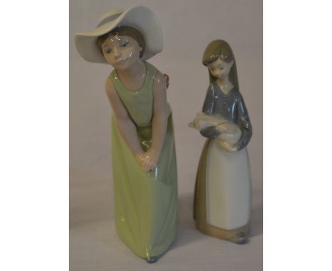 Lladro figures 'Curious Girl with Hat' and a young girl holding a piglet