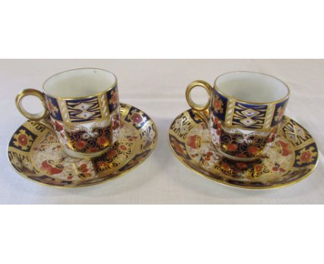 Pair of Imari coffee cups and saucers pattern no 2614 crown mark to underside