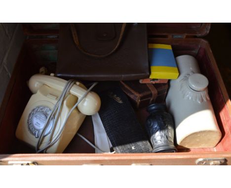 Suitcase of mixed items including retro rotary telephone, ceramic hot water bottle etc