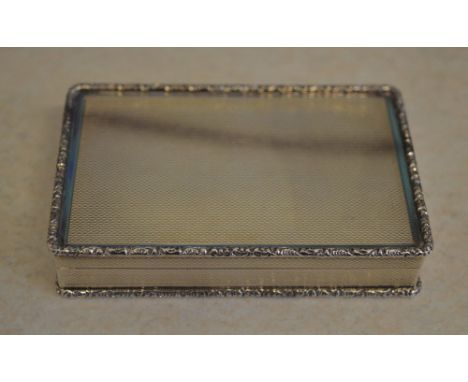 Silver cigarette case with gilt interior, with a simple engine turned design and ornate edges, Birmingham 1978 and makers mar