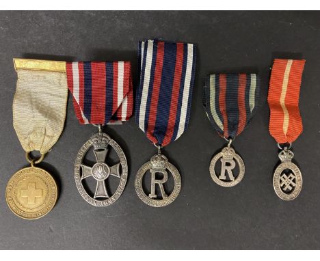 A COLLECTION OF MEDALS FOR NURSING. Medals for nursing: The British Red Cross Society Medal for War Service 1914-18, on a whi