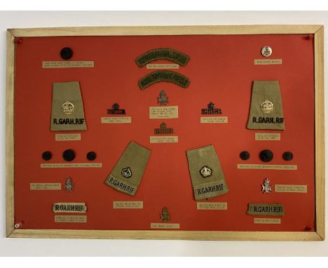 A COLLECTION OF 18TH ROYAL GARHWAL RIFLES BUTTONS BADGES AND TITLES. A collection of 18th Garhwal Rifles badges to include an