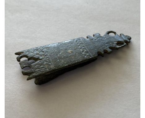 AN ELABORATE MEDIEVAL STRAP END. A Medieval Elaborate Strap End, c. 14th Century. The copper-alloy strap end formed of two sh