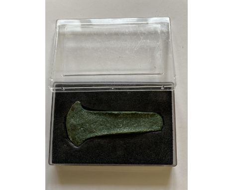 AN EARLY TO MIDDLE BRONZE AGE FLANGED AXE. An Early to Middle Bronze Age Copper-Alloy Flanged Axe, c.2000-1500 B.C. The cast 