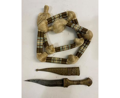 A SMALL KNIFE AND SCABBARD AND HEAD DRESS BAND. An African knife with a double edged 14.5cm curved blade with central rib, th