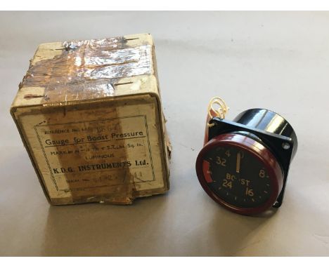 A MILITARY AIRCRAFT BOOST GAUGE, UNUSED IN BOX. An aircraft boost gauge with numbered dial, marked to the reverse with a moul
