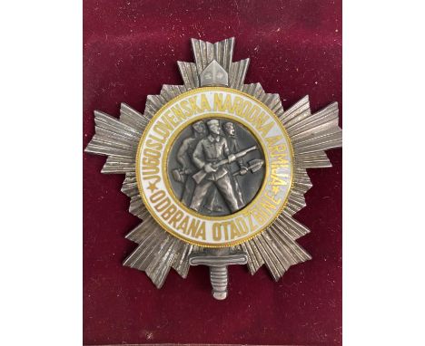 THE YUGOSLAVIAN ORDER OF THE PEOPLE'S ARMY. A breast worn badge for the Yugoslavian Order of the People's Army, 3rd Class, wi