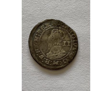 A CHARLES I HALFGROAT. A Charles I hammered silver halfgroat, crowned portrait, l. with II behind the bust, reverse with deco