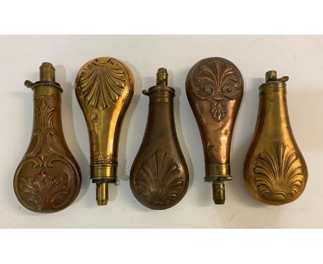 A COLLECTION OF FIVE BRASS AND COPPER POWDER FLASKS BY BARTRAM AND OTHERS. A brass and copper powder flask with embossed acan