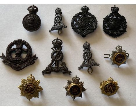 A COLLECTION OF SECOND WORLD WAR ECONOMY BADGES. Bakelite cap badges for the Army Catering Corps and Middlesex Regiment. Othe