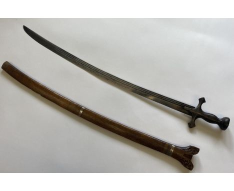 A SUMATRAN 'BATAK' SWORD AND SCABBARD. With a 74cm slightly curved single edged blade with three shallow fullers, straight tr