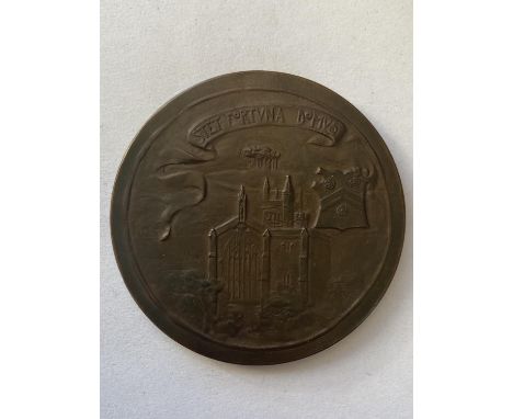 A WICHESTER COLLEGE QUINCENTENARY MEDAL BY GEORGE FRAMPTON. A large bronze medal, obverse with a robed figure of the Archbish