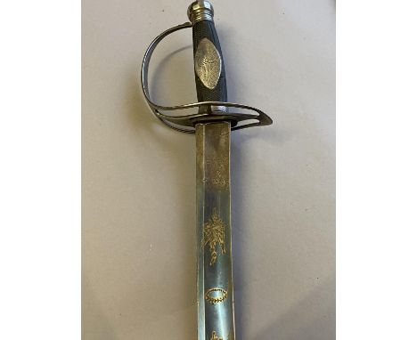 AN UNUSUAL SLOTTED HILT SABRE. With a 72cm curved single edged fullered blade, partially blued and decorated in gilt with mil