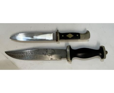 A SECOND WORLD WAR OR LATER SS STYLE DAGGER BY WHITBY OF SOLINGEN AND ANOTHER. A German fighting knife or dagger with an 18cm