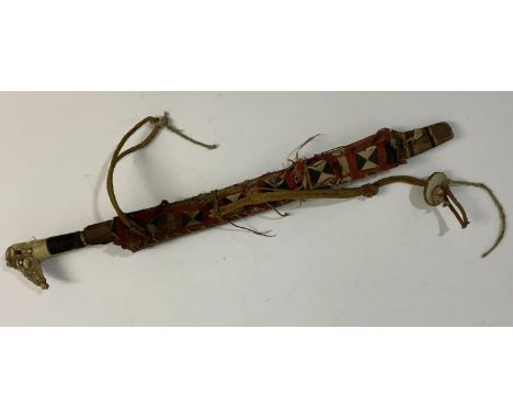 A BORNEO 'HEAD HUNTERS' SWORD AND SCABBARD. A Dyack type 'Head Hunters' sword and scabbard with profusely carved bone handle 