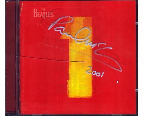 Paul McCartney signed Beatles 1 album case. CD included. Good condition. All autographs come with a Certificate of Authentici