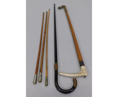 A collection of items, to include three regimental swagger sticks, a walking stick with antler handle and an ebonised metal a