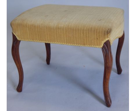 A Victorian walnut stool, with a padded seat, on cabriole legs, 57cm wide (M)