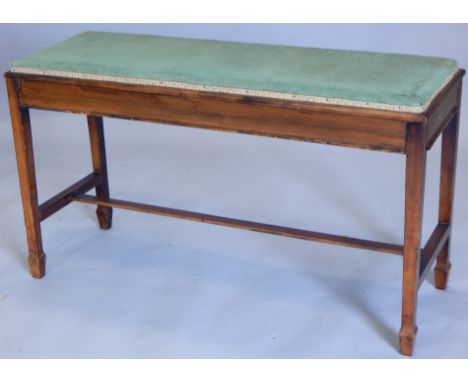 An Edwardian mahogany duet stool, with a padded seat, on square tapering legs (M)