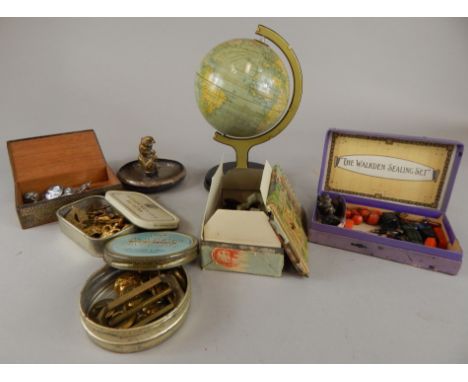 Miscellaneous advertising pieces, etc., to include a tin plate globe, various regimental buttons etc. (M)