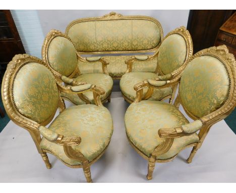 A Continental gilt gesso five piece salon suite, in the French taste, each with a padded back, armrest and seat, on turned le