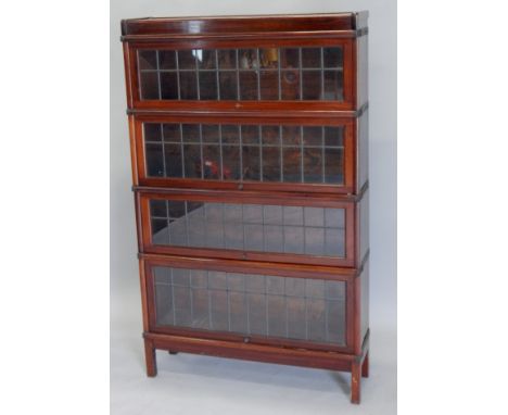 A Globe Wernicke mahogany three sectional solicitors type bookcase, with leaded glazed sliding doors, 142cm high, 86cm wide (