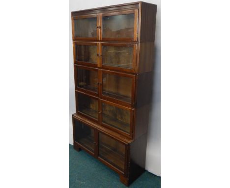 An early 20thC four section mahogany Globe Wernicke type bookcase, with two pairs of glazed doors, on bracket feet, 164cm hig