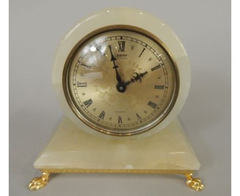 A late 20thC onyx mantel clock, the dial stamped Xavier, quartz, 13cm wide (M)